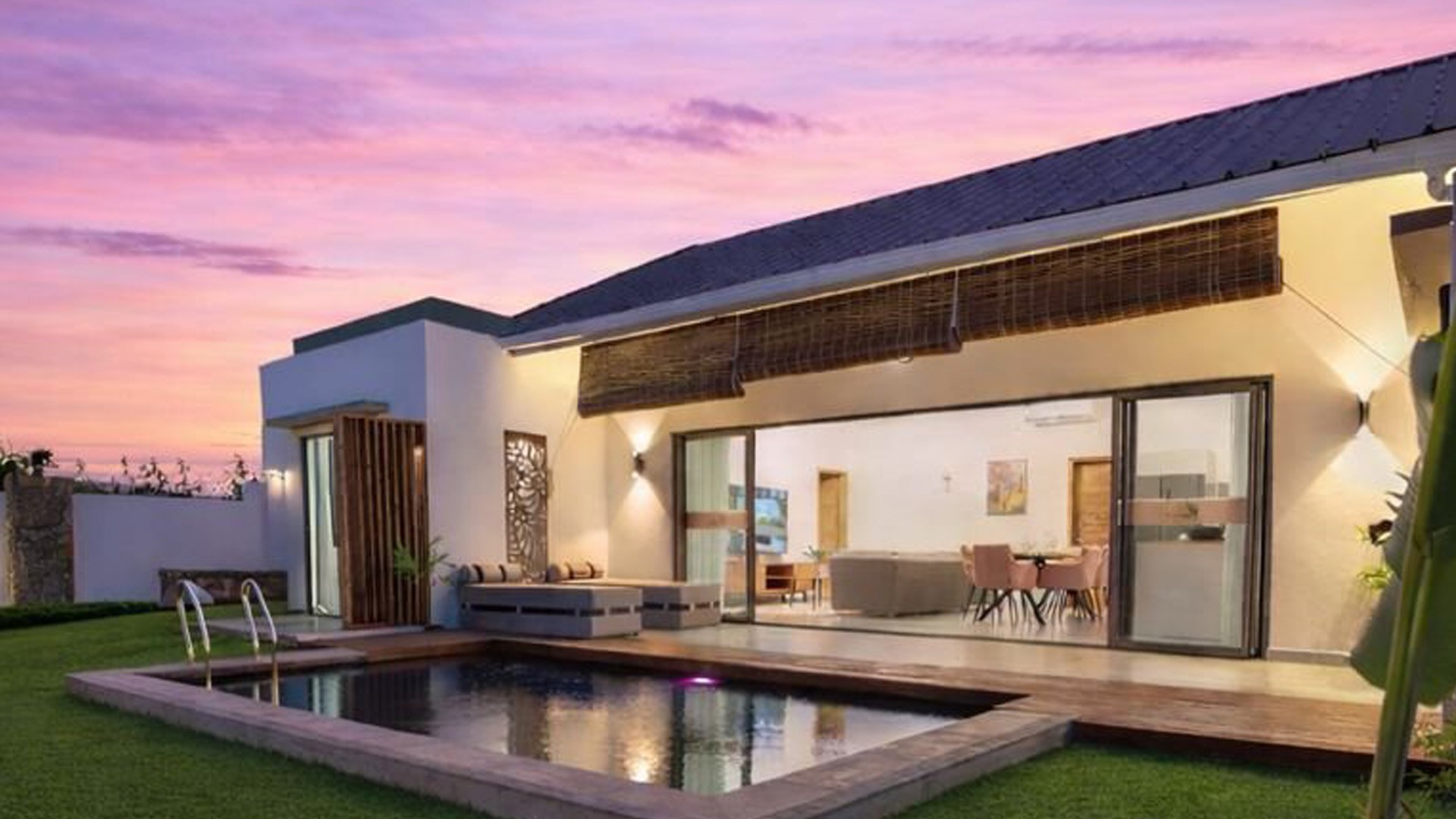 Arama Villa at sunset with pool